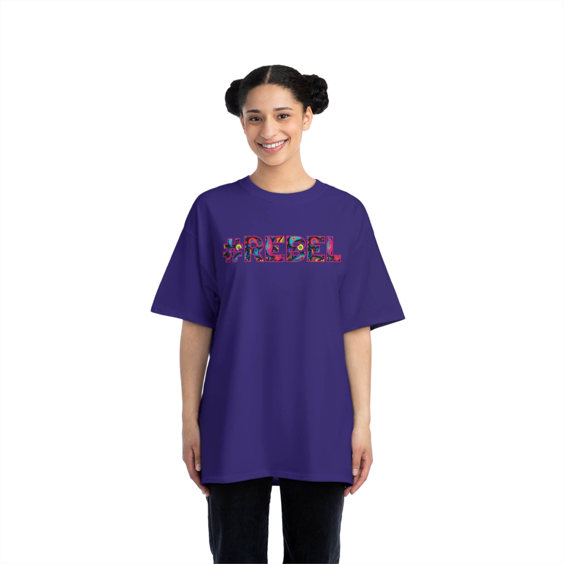 #REBEL meme printed at the front of this purple, wide, relaxed t shirt for women. Are you a rebel by soul? Are you ready to wear this name proudly? Then this t shirt is a must have for you! 