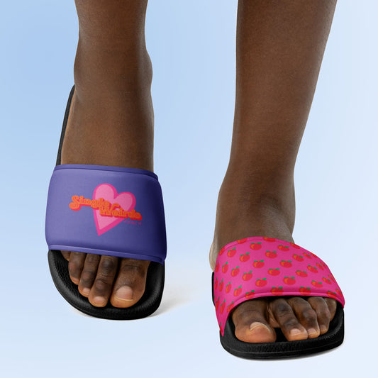 Women's slides for single women! One slide is purple with our single weirdo funny meme and the other slide is pink with a peach pattern.