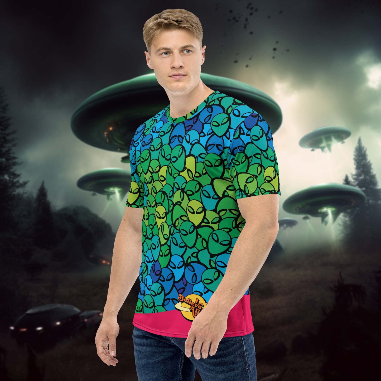 This Aliens shirt for men has aliens printed all over the t-shirt and has a bright pink bottom and the 'I believe in Aliens' meme at the left bottom.