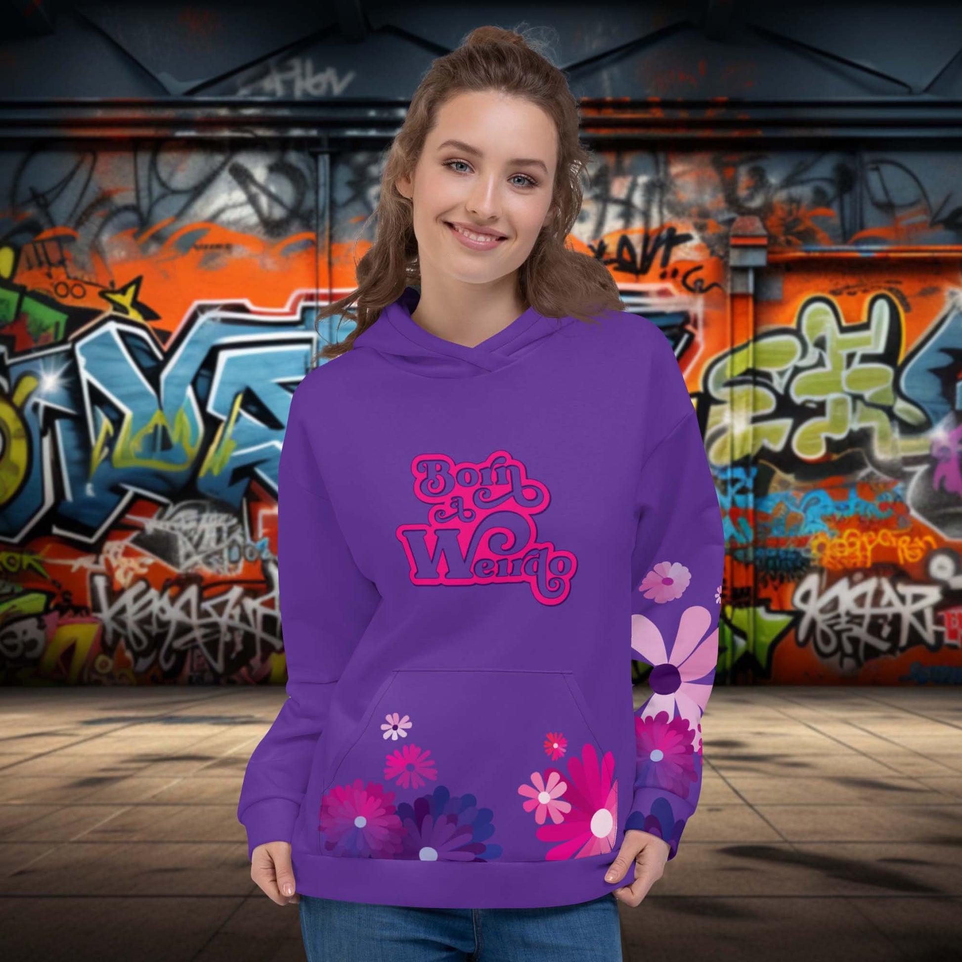 purple hoodie for women with 'born a weirdo' meme shown at the front of the hoodie. purple and pink flowers are also shown on the women's purple hoodie.