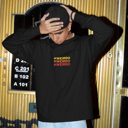 young man wearing a black sweatshirt with weirdo meme embroidery in yellow, orange and red colors