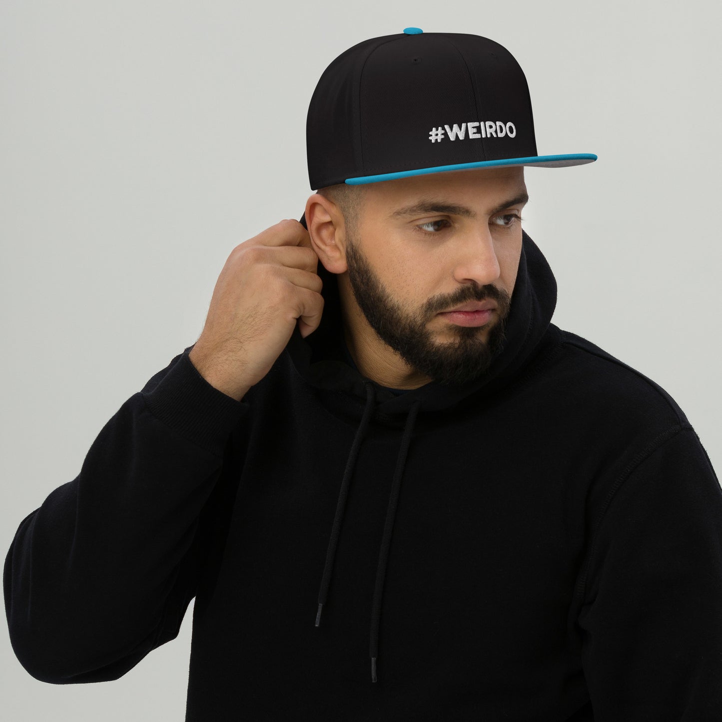 #WEIRDO meme is embroidered in white at the front of this black and blue snapback cap. We got this and many more funny hats for adults who are weird! Check out all our weird gifts for weird people in our online gift store for weirdos!