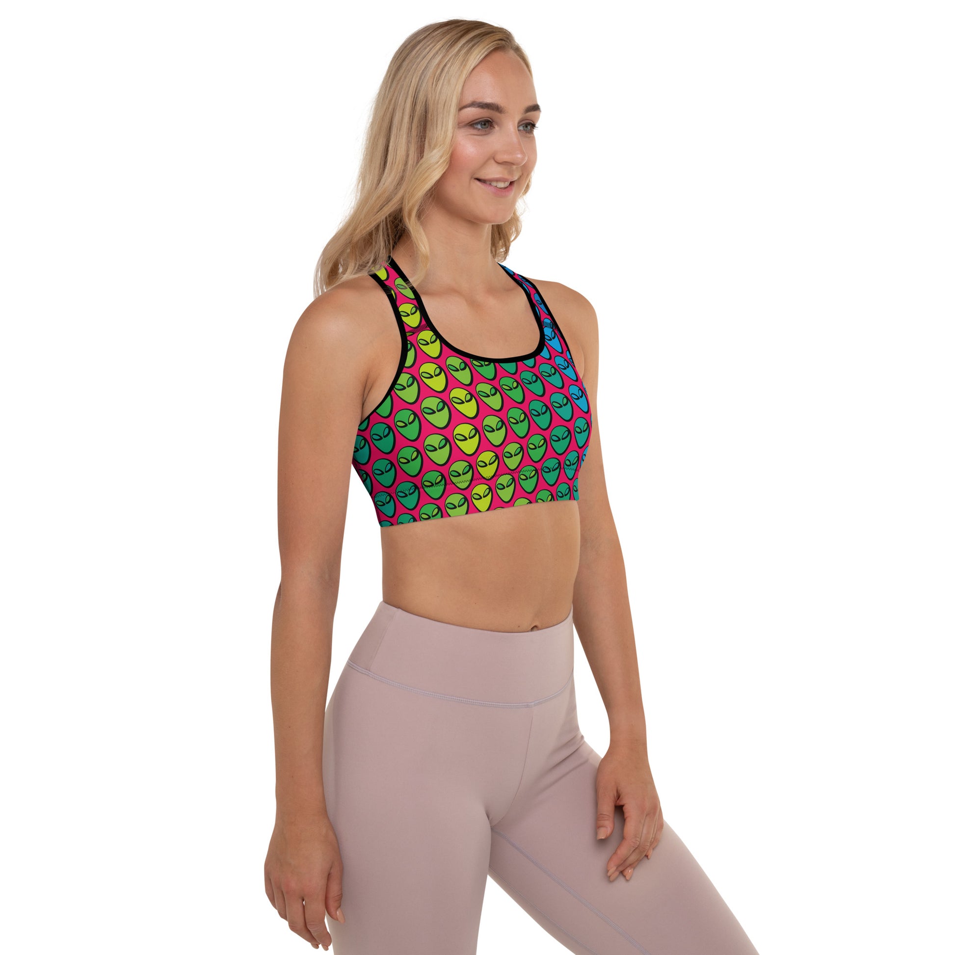 Weirdo | This padded sports bra is specially designed for you weirdos who know that aliens are real! The sports bra has alien heads printed in colors all over.